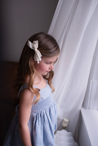 A pair of white hair clip