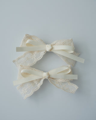 A pair of white hair clip