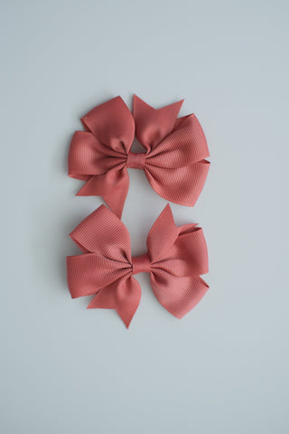 A pair of pink hair clip