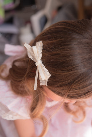A pair of white hair clip